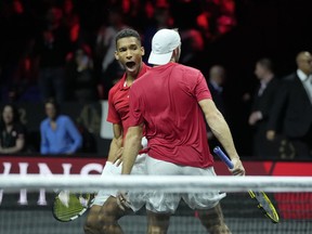 Team World's Jack Sock, right, and Felix Auger-Aliassime celebrate after winning a match against Team Europe's Andy Murray and Matteo Berrettini on final day of the Laver Cup tennis tournament at the O2 in London, Sunday, Sept. 25, 2022. Auger-Aliassime and Denis Shapovalov of Richmond Hill, Ont., headline Canada's tennis team for the Davis Cup Finals next month in Spain.