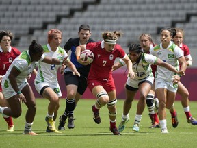 Canada's Karen Paquin, center, is pursued by Brazil's, from left, Mariana Nicolau, Luiza Campos, and Thalita da Silva Costa, in their women's rugby sevens match at the 2020 Summer Olympics, Thursday, July 29, 2021 in Tokyo, Japan. Tyson Beukeboom, Karen Paquin and Elissa Alarie kick off their third Rugby World Cup on Saturday when third-ranked Canada takes on No. 13 Japan in Pool B play at Northland Events Centre in Whangarei, New Zealand.THE CANADIAN PRESS/AP, Shuji Kajiyama