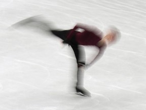 Keegan Messing, of Canada, performs in the men free program at the Figure Skating World Championships in Montpellier, south of France, Saturday, March 26, 2022.&ampnbsp;Messing once dreamed about being history's first to land a quadruple Axel, the most difficult jump in figure skating, but the 30-year-old said age caught up with him.