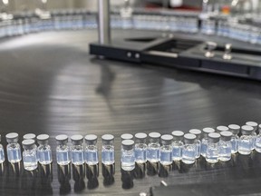 This August 2022 photo provided by Pfizer shows vials of the company's updated COVID-19 vaccine during production in Kalamazoo, Mich. Ontario's health minister says the newly approved Pfizer-BioNTech COVID-19 booster vaccine means youth aged 12 to 17 can get a dose heading into the colder months. THE CANADIAN PRESS/Pfizer via AP
