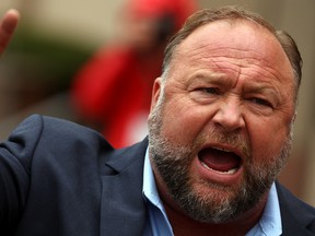 Infowars founder Alex Jones speaks to reporters after appearing at his Sandy Hook defamation trial at Connecticut Superior Court in Waterbury, Connecticut, U.S., October 4, 2022.