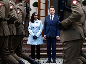 Canadian Defence Minister Anita Anand and her Polish counterpart Mariusz Blaszczak review the honor guard during a welcoming ceremony in Warsaw, Poland October 11, 2022.
