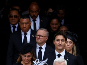 Prime Minister Justin Trudeau, his wife Sophie Gregoire Trudeau and Jamaica's Prime Minister Andrew Holness leave Westminster Abbey on the day of the state funeral of Queen Elizabeth II.