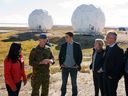 NATO Secretary General Jens Stoltenberg, right, talks to Prime Minister Justin Trudeau, Defense Minister Anita Anand and Foreign Minister Melanie Joly near radar domes during a visit to the arctic community of Cambridge Bay, Nunavut, on August 25, 2022.