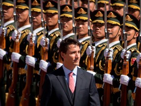 Prime Minister Justin Trudeau reviews a Chinese honour guard during a welcome ceremony at the Great Hall of the People in Beijing, in 2016.