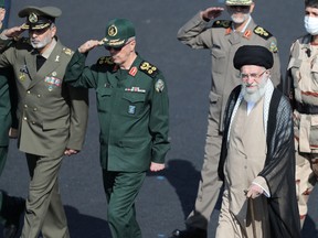 Iranian Supreme Leader Ayatollah Ali Khamenei, front right, reviews armed forces during a graduation ceremony at a police academy in Tehran, on Oct. 3.