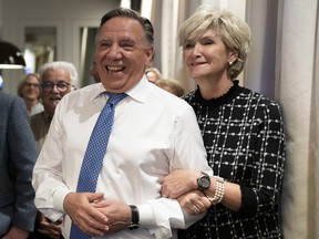 Coalition Avenir Quebec Leader Francois Legault and his wife Isabelle Brais watch the election results in Quebec City, October 3, 2022.
