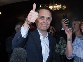 Mark Sutcliffe gives the thumbs up to supporters as he arrives for his victory party after being elected Ottawa mayor  on Monday, Oct. 24, 2022.