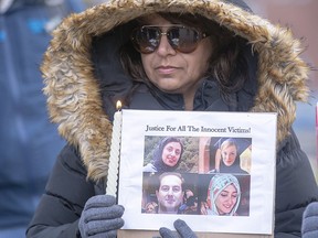 A mourner takes part in a vigil in London, Ont., for victims of the crash of Ukraine International Airlines Flight PS752 in January 2020. Four Western University students were among the 176 people, including 55 Canadians and 30 permanent residents, killed when the Islamic Revolutionary Guard Corps (IRGC) shot down the jet shortly after it took off from Tehran.