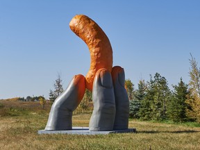 The 17-foot-tall Cheetle Hand Statue, stands in the hamlet of Cheadle, Alta. (CNW Group/PepsiCo Foods Canada)