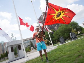 Steve Mull, a member of the Pine Creek First Nation and a Sixties Scoop survivor, performs a ceremonial song at Windsor's waterfront on Canada Day, Thursday, July 1, 2021.