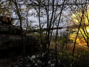 Ukrainian tanks fire on Russian positions Bakhmut, Ukraine, Oct. 2, 2022. (AP Photo/Inna Varenytsia)