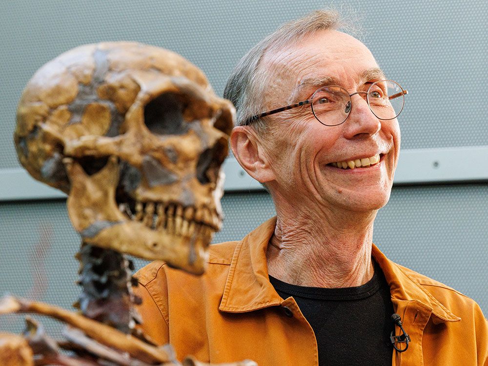Anthropologist Svante Paabo poses with a model of a Neanderthal skeleton after winning the Nobel Prize in Physiology or Medicine on Oct. 3, 2022, in Leipzig, Germany. 