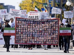 Protesters march to Parliament Hill as they demonstrate against Iran on Tuesday, Oct. 4, 2022 in Ottawa.