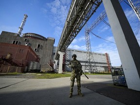 FILE - A Russian serviceman guards in an area of the Zaporizhzhia Nuclear Power Station in territory under Russian military control, southeastern Ukraine, on May 1, 2022. Ukraine's Zaporizhzhia nuclear power plant, the biggest in Europe, has lost its last remaining external power source as a result of renewed shelling and is now relying on emergency diesel generators, the U.N. nuclear watchdog said Saturday, Oct. 8, 2022. (AP Photo, File)