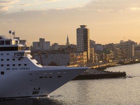 FILE - In this Feb. 4 2016 photo the MSC Opera cruise ship passes the Malecon sea wall as it leaves the harbor in Havana, Cuba. A third cruise ship has been hired by Qatari World Cup organizers to operate as a fans' hotel docked in Doha port. It will add much-needed rooms during the month-long tournament. Geneva-based MSC Cruises announced the agreement just six weeks before the World Cup starts for the 1,075-cabin MSC Opera.