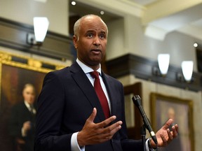 Minister of Housing and Diversity and Inclusion Ahmed Hussen speaks during a news conference in the foyer of the House of Commons in Ottawa on June 6,.