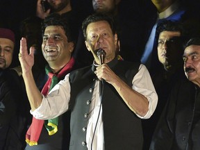 FILE - Pakistan's former Prime Minister Imran Khan, center, addresses during an anti-government rally in Islamabad, Pakistan, Saturday, Aug. 20, 2022. Pakistan's elections commission on Friday, Oct. 21, 2022, disqualified Khan on charges of concealing assets, a move which is likely to deepen lingering political turmoil.