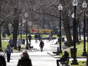 People walk on Boston Common, Saturday, April 4, 2020, in Boston. Boston Common, America's oldest public park, is getting a makeover that city officials hope will make it a more fun, convenient, and a place for both city residents and tourists alike.