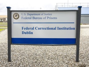 FILE - A sign for the Federal Correctional Institution Dublin is displayed Jan. 9, 2019, in Dublin, Calif. One of five workers accused of sexually abusing inmates at a federal women's prison in California has pleaded guilty and could face up to two years in prison. Enrique Chavez entered the plea on Thursday, Oct. 27, 2022. Authorities say he was a food service foreman at the San Francisco Bay Area federal lockup in Dublin two years ago when he fondled an inmate in a locked pantry.
