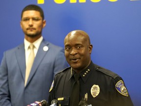 Stockton Police Chief Stanley McFadden, right, flanked by Stockton Mayor Kevin Lincoln, left, updates reporters about the investigation into the fatal shooting of six men and the wounding of one woman dating back to last year, during a news conference in Stockton, Calif., Tuesday, Oct. 4, 2022.