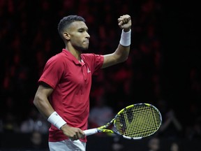 Team World's Felix Auger-Aliassime celebrates after winning a point against Team Europe's Andy Murray and Matteo Berrettini on final day of the Laver Cup tennis tournament at the O2 in London, Sunday, Sept. 25, 2022.