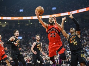 Toronto Raptors guard Fred VanVleet (23) lays up the ball while defended by Cleveland Cavaliers forward Isaac Okoro (35) during first half NBA action, in Toronto, on Wednesday, October 19, 2022.