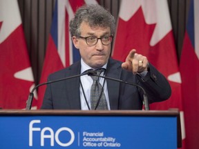 Ontario Financial Accountability Officer Peter Weltman answers questions in Toronto on Monday December 10, 2018. Ontario's Progressive Conservative government is not being transparent about how it plans to spend money over the next several years, the province's financial watchdog said Thursday.THE CANADIAN PRESS/Frank Gunn