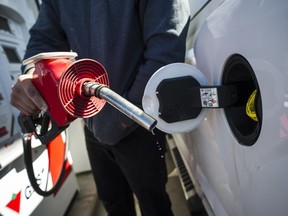 A man fills up his truck with gas in Toronto, on Monday April 1, 2019. Millions of Canadians in Alberta, Saskatchewan, Manitoba and Ontario will receive their quarterly carbon price rebate payments Friday.