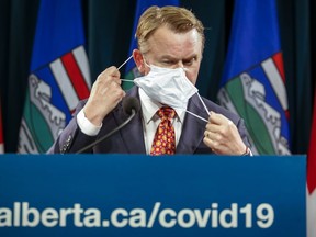 Then Alberta Health Minister Tyler Shandro announces new COVID-19 measures for Alberta in Calgary, Wednesday, Sept. 15, 2021. Alberta's premier says she's directing her justice minister to defend the province's "full authority" after a court said rescinding mask mandates in schools earlier this year violated the law and was unreasonable.