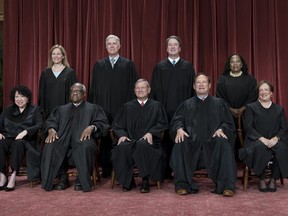 Members of the Supreme Court sit for a new group portrait following the addition of Associate Justice Ketanji Brown Jackson, at the Supreme Court building in Washington, Friday, Oct. 7, 2022. Bottom row, from left, Associate Justice Sonia Sotomayor, Associate Justice Clarence Thomas, Chief Justice of the United States John Roberts, Associate Justice Samuel Alito, and Associate Justice Elena Kagan. Top row, from left, Associate Justice Amy Coney Barrett, Associate Justice Neil Gorsuch, Associate Justice Brett Kavanaugh, and Associate Justice Ketanji Brown Jackson.