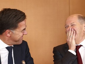 German Chancellor Olaf Scholz and Mark Rutte, Prime Minister of the Netherlands, left, attend a joint meeting of the Climate Cabinet at the Chancellery in Berlin, Germany, Tuesday, Oct. 4, 2022.
