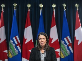 Alberta Premier Danielle Smith holds her first press conference in Edmonton, on Tuesday, Oct. 11, 2022. Smith has revealed her new cabinet. It includes some ministers staying in high-profile roles: Travis Toews in finance, Jason Copping in health, Adriana LaGrange in education and Tyler Shandro in justice.