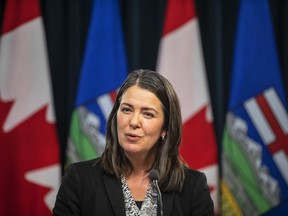 Alberta Premier Danielle Smith holds her first press conference in Edmonton, Tuesday, Oct. 11, 2022. Alberta's Opposition NDP says Premier Danielle Smith needs to apologize for her remarks on the Russia-Ukraine war.