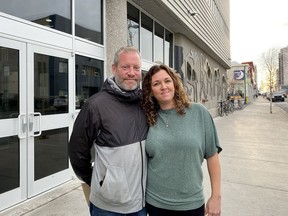 Owners of The Monkey Tree Pub, Steve Dinham, left, and Jennifer Vornbrock, are seen outside the courthouse in Yellowknife, Friday, Oct. 7, 2022. The owners say they're relieved after they learned they wouldn't have to pay a ticket for allegedly violating Northwest Territories COVID-19 public health orders.