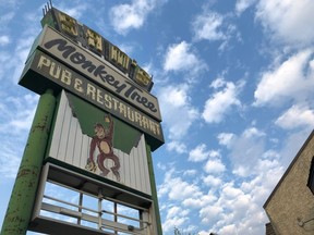 The Monkey Tree Pub sign is shown outside of the establishment in Yellowknife on Thursday, Aug. 4, 2022. The owners of a pub in Yellowknife headed to trial on Thursday to fight a charge for allegedly violating territorial public health orders related to COVID-19 nearly two years ago.