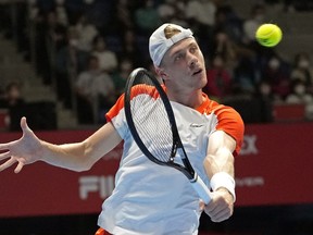 Denis Shapovalov, of Canada, returns to Steve Johnson of the U.S. during a singles match in the Rakuten Open tennis championships at Ariake Colosseum Wednesday, Oct. 5, 2022, in Tokyo.