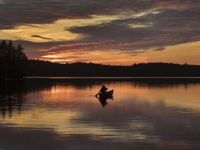 Olivia Gerelus goes for a sunset paddle in Algonquin Park Friday June 11, 2021. Ontario Parks says it is cutting the maximum length of stay at several provincial campgrounds next summer amid a surge in demand.