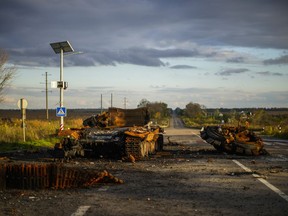 Remains of a destroyed Russian tank are scattered on the ground along the road between Izium and Kharkiv, Ukraine, Monday, Oct. 3, 2022.