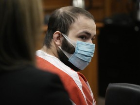 FILE - Ahmad Al Aliwi Alissa listens during a hearing in Boulder, Colo., Sept. 7, 2021. Alissa, charged with killing 10 people at a Colorado supermarket last year, is still incompetent to stand trial, a judge ruled Friday, Oct. 21, 2022,, keeping his prosecution on hold.