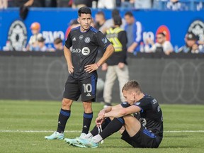 CF Montreal teammates Joaquin Torres (10) and Alistair Johnston react after losing the MLS Eastern Conference semifinals game against New York City in Montreal, Sunday, October 23, 2022.