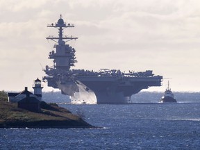 The USS Gerald R. Ford, one of the world's largest aircraft carriers, arrives in Halifax on Friday, Oct. 28, 2022. The United States Navy's most advanced aircraft carrier is on its first deployment, five years after it was commissioned into service.