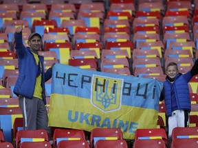 Ukrainian fans cheer prior to the star of the UEFA Nations League soccer match between Scotland and Ukraine, at Hampden Park, in Glasgow, Scotland, Wednesday, Sept. 21, 2022.