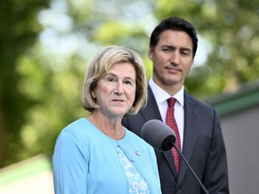 Minister of Public Services and Procurement Helena Jaczek speaks to reporters as Prime Minister Justin Trudeau looks on, at Rideau Hall in Ottawa, on Wednesday, Aug. 31, 2022.