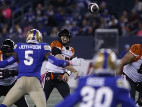 B.C. Lions quarterback Nathan Rourke (12) throws against the Winnipeg Blue Bombers during first half CFL action in Winnipeg Friday, October 28, 2022.