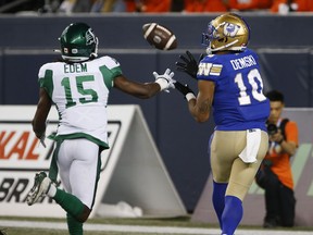 Winnipeg Blue Bombers' Nic Demski (10) catches the touchdown pass as Saskatchewan Roughriders' Mike Edem (15) defends during first half CFL action in Winnipeg Friday, September 30, 2022. Montreal Alouettes linebacker Tyrice Beverette and Nic Demski and quarterback Zach Collaros have been named Canadian Football League's top performers for Week 17,THE CANADIAN PRESS/John Woods