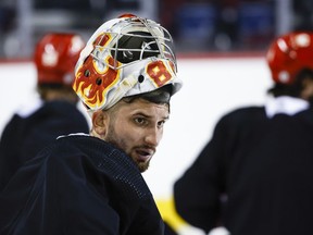 Calgary Flames goalie Dan Vladar takes a break during a training camp practice in Calgary, Alta., Thursday, Sept. 22, 2022. The Flames have signed Vladar to a two-year, $4.4-million contract extension.&ampnbsp;THE CANADIAN PRESS/Jeff McIntosh