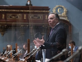 Quebec Premier François Legault responds during question period Thursday, Dec. 9, 2021, at the legislature in Quebec City.
