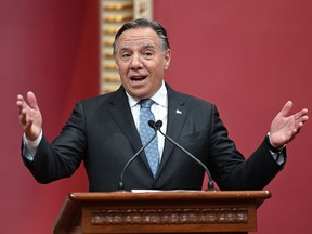 Quebec Premier François Legault speaks to guests after his government was sworn in, Tuesday, Oct. 18, 2022, during a ceremony at the legislature in Quebec City. Legault will unveil the new Quebec cabinet later today during a ceremony at the national assembly.