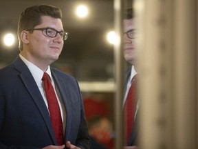 FILE - Kansas treasurer Jake LaTurner takes a moment before speaking to reporters after winning the Republican primary in Kansas' 2nd Congressional District on Aug. 4, 2020, in Topeka, Kan. A northeastern Kansas man is facing a felony charge of threatening to kill LaTurner, but his trial has been postponed indefinitely so that a federal judge can decide whether he is too mentally ill to help his lawyers or follow what is going on in court.
